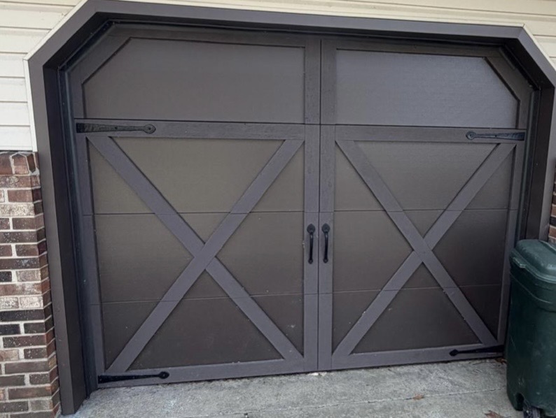 Brown carriage-style garage door repair — after
