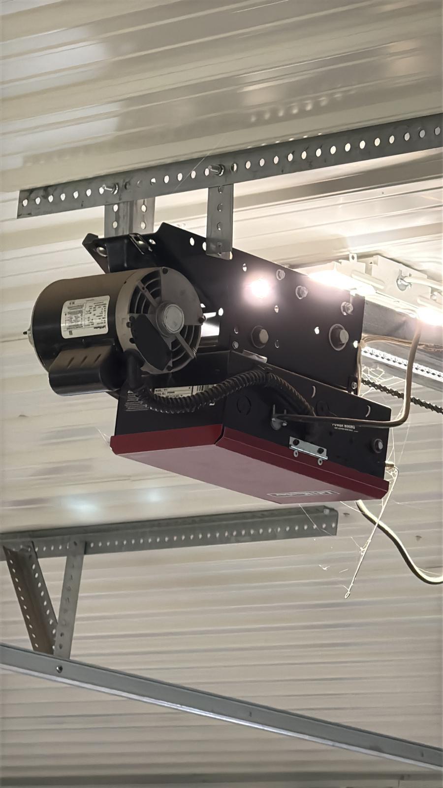 Commercial jackshaft garage door opener in Marietta, GA Heavy-duty commercial jackshaft garage door operator mounted on a warehouse wall in Marietta, GA